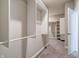 Expansive walk-in closet with built-in shelving, and soft carpet, offering style and functionality at 3581 Free Spirit Ct, Westfield, IN 46074