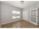Bedroom featuring wood-look floors, a double door closet, and a window at 3792 Waterfront Way, Plainfield, IN 46168