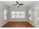 Light-filled bedroom with hardwood floors and picturesque views of the lake through large windows at 3792 Waterfront Way, Plainfield, IN 46168
