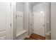Entryway with a built-in bench and coat rack, and wood-look flooring at 3792 Waterfront Way, Plainfield, IN 46168