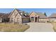 Charming brick home featuring manicured landscaping, a two-car garage, and a welcoming driveway at 3792 Waterfront Way, Plainfield, IN 46168