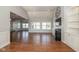 Spacious living room with hardwood floors, bright windows, and seamless transition to other rooms at 3792 Waterfront Way, Plainfield, IN 46168