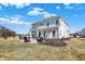 Spacious backyard featuring a patio, fire pit, and well-manicured landscaping, ideal for outdoor living at 4052 Saddle Club S Pkwy, Bargersville, IN 46106