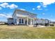 Well-maintained backyard showing the patio and fire pit area of a two-story home at 4052 Saddle Club S Pkwy, Bargersville, IN 46106
