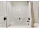 Clean, white bathroom with a shower featuring a shower curtain, offering a minimalist style at 4052 Saddle Club S Pkwy, Bargersville, IN 46106