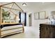 Bright bedroom featuring a gold canopy bed, giraffe wall art, and closet access at 4052 Saddle Club S Pkwy, Bargersville, IN 46106