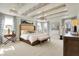 Serene main bedroom with tray ceiling, chandelier, and lots of natural light at 4052 Saddle Club S Pkwy, Bargersville, IN 46106