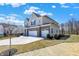 Stunning two-story home boasts a three-car garage and a neatly maintained lawn at 4052 Saddle Club S Pkwy, Bargersville, IN 46106