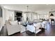 Spacious living room with modern decor, stone fireplace, and hardwood floors at 4052 Saddle Club S Pkwy, Bargersville, IN 46106