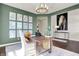 Beautiful home office showcasing custom decor, hardwood floors, and large windows at 4052 Saddle Club S Pkwy, Bargersville, IN 46106