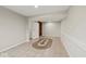This basement features neutral walls, tiled floor and an ornamental rug at 4448 Aristocrat Cir, Indianapolis, IN 46235