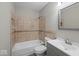 Tiled bathroom features a tub, shower, toilet and vanity with sink at 4448 Aristocrat Cir, Indianapolis, IN 46235