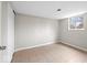 Cozy bedroom featuring neutral walls, tiled floors, and a window at 4448 Aristocrat Cir, Indianapolis, IN 46235
