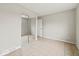 This bedroom features neutral walls, tiled floors, and mirrored closet at 4448 Aristocrat Cir, Indianapolis, IN 46235