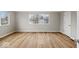 Bedroom with hardwood floors, large window and neutral paint at 4448 Aristocrat Cir, Indianapolis, IN 46235