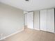 Clean bedroom featuring neutral walls, tiled floors, and closet at 4448 Aristocrat Cir, Indianapolis, IN 46235