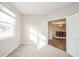 Bright, carpeted room with a view of the dining room at 4720 W Tradwell Dr, New Palestine, IN 46163