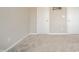 View of bedroom showing neutral paint and doors at 4720 W Tradwell Dr, New Palestine, IN 46163