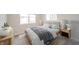 Bright bedroom featuring a comfortable bed with stylish lamps and modern decor at 4720 W Tradwell Dr, New Palestine, IN 46163