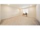 Spacious bonus room with neutral carpet, natural light, and modern finishes at 4720 W Tradwell Dr, New Palestine, IN 46163