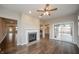 Living room with hardwood floors, recessed lighting, and fireplace at 4720 W Tradwell Dr, New Palestine, IN 46163