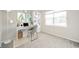 Well-lit room with a desk, chair, bookshelf, and a large window at 4720 W Tradwell Dr, New Palestine, IN 46163