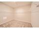 Empty walk-in closet space with neutral carpet and installed shelving at 4720 W Tradwell Dr, New Palestine, IN 46163