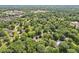 Expansive aerial view of a residential neighborhood with lush trees and scenic surroundings at 4754 E 64Th St, Indianapolis, IN 46220
