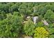 An aerial view of the home surrounded by mature trees and lush greenery at 4754 E 64Th St, Indianapolis, IN 46220