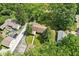 Aerial view of a home surrounded by lush greenery and trees, offering a private and serene setting at 4754 E 64Th St, Indianapolis, IN 46220