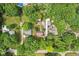 Birds eye view of a neighborhood with mature trees and well-maintained lawns at 4754 E 64Th St, Indianapolis, IN 46220