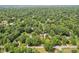 Lush, mature trees surround homes in this densely canopied neighborhood at 4754 E 64Th St, Indianapolis, IN 46220