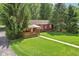Beautiful backyard view with a cozy porch and a well-kept green lawn at 4754 E 64Th St, Indianapolis, IN 46220