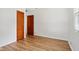 Bright bedroom with hardwood floors, white walls, and a window that provides natural light at 4754 E 64Th St, Indianapolis, IN 46220