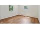 A bedroom with two windows and wood-look floors at 4754 E 64Th St, Indianapolis, IN 46220