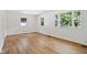 Bright, airy bedroom with light hardwood floors and multiple windows at 4754 E 64Th St, Indianapolis, IN 46220