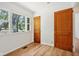 A bedroom featuring natural light and wood-look floors at 4754 E 64Th St, Indianapolis, IN 46220