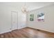 Bright bedroom with wood-look floors, closet, neutral decor, and two windows at 4754 E 64Th St, Indianapolis, IN 46220