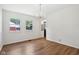 Bright dining room features wood-look floors, a chandelier, and multiple windows at 4754 E 64Th St, Indianapolis, IN 46220