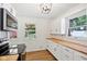 Bright kitchen with wooden countertops, white cabinets, modern appliances, and natural light streaming in at 4754 E 64Th St, Indianapolis, IN 46220