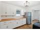 Bright kitchen with white cabinets, stainless steel appliances, and butcher block counters at 4754 E 64Th St, Indianapolis, IN 46220
