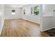 Bright living room with hardwood floors, large windows, and neutral decor at 4754 E 64Th St, Indianapolis, IN 46220