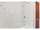Shower features a white tile surround with an adjustable shower head at 4754 E 64Th St, Indianapolis, IN 46220