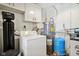 Utility room featuring a furnace, water heater, water softener and a washing machine at 4754 E 64Th St, Indianapolis, IN 46220
