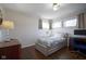 Bright bedroom with hardwood floors, neutral walls, and comfortable decor at 5415 Wallace Ave, Indianapolis, IN 46220