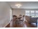 Open concept dining room with hardwood floors and a view of the backyard at 5415 Wallace Ave, Indianapolis, IN 46220