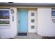 Charming front entry with a light blue front door and decorative glass blocks at 5415 Wallace Ave, Indianapolis, IN 46220
