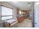 Kitchen showcasing stainless steel appliances, wood cabinets, a breakfast nook and tile flooring at 5415 Wallace Ave, Indianapolis, IN 46220