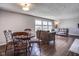 Comfortable living room with hardwood floors and a dining table, great for entertaining at 5415 Wallace Ave, Indianapolis, IN 46220