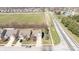 Birds eye view of a suburban residence with a scenic view of nearby sports field and mature landscaping at 5944 Edelle Dr, Indianapolis, IN 46237